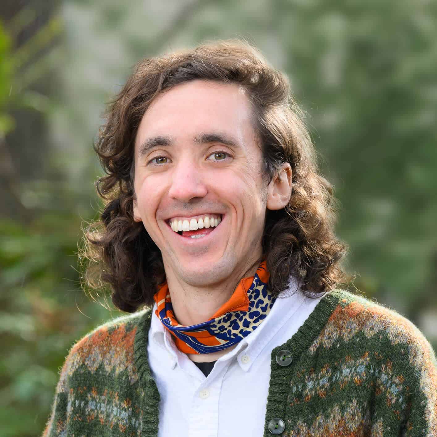 EcoNW Northwest environmental expert smiling outdoors in nature.