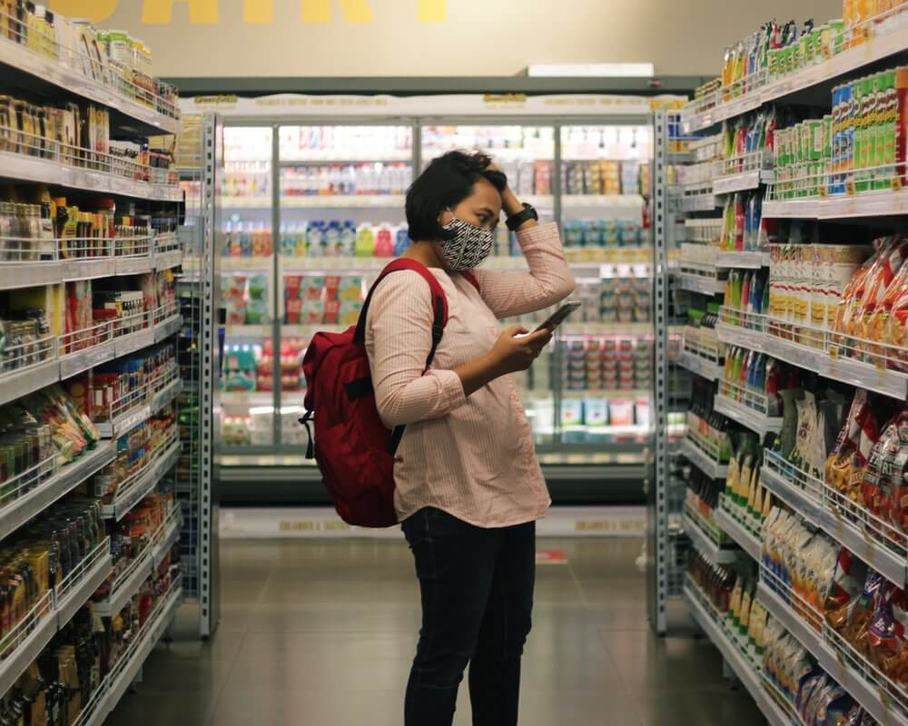 Woman browsing grocery aisle